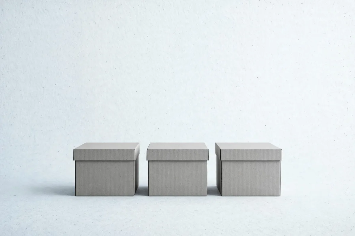 A row of three closed archive boxes