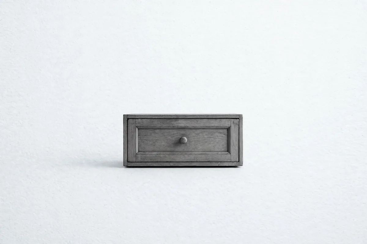 A closed wooden drawer