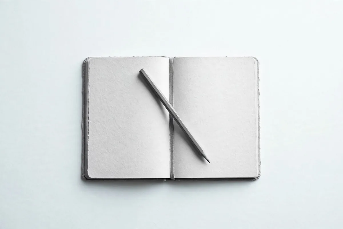 A notebook with a pencil
